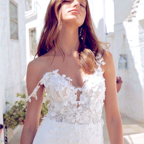 Never worn or altered wedding dress, size 12 but fits a size 4 jeans well. - Picture 2 of 6